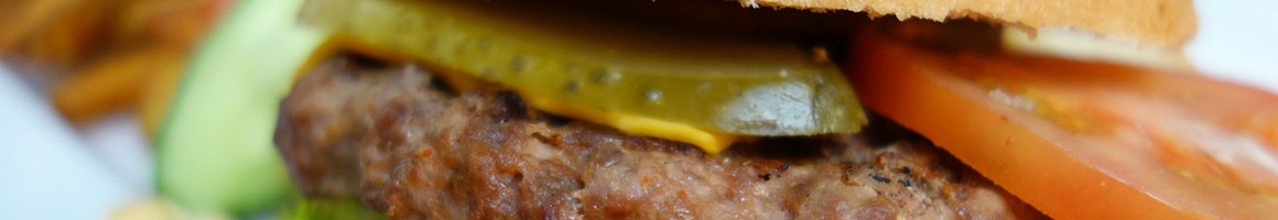 Eating American (Traditional) Burger at Bill's Bar & Burger restaurant in Pittsburgh, PA.